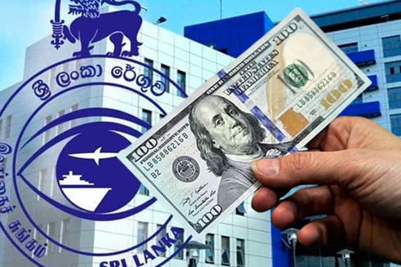 රුපියල ශක්තිමත් වෙද්දී රේගුවෙන් ‘කෘත්රිම ඩොලර් අගයක්’: අත්යවශ්ය භාණ්ඩ මිල යළිත් ඉහළ යාමේ අවදානමක්!