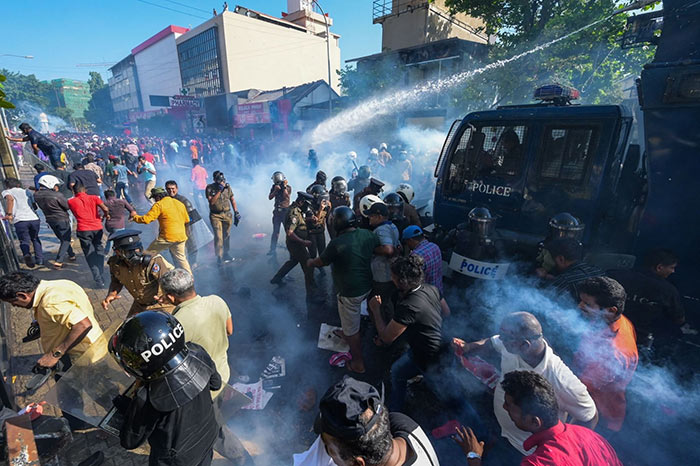 sri lanka police use water cannons and tear gas to disperse protesters