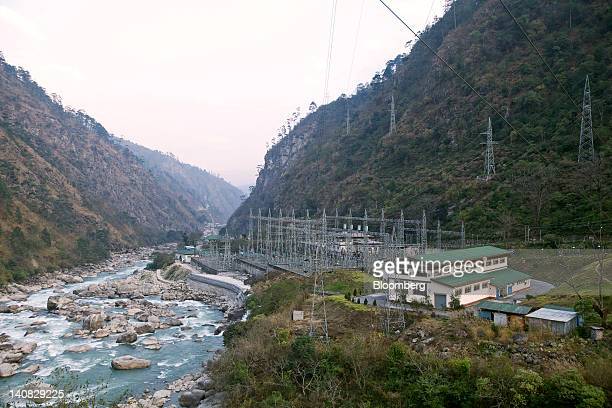A power station stands at the site of the Punatsangchhu hydro-electric power project in Wangdue, Bhutan, on Saturday, Feb. 11, 2012. Bhutan, with a population of just over 700,000 sandwiched between China and India, uses an index called "Gross National Happiness" to measure the success of its economy. Photographer: Adeel Halim/Bloomberg via Getty Images