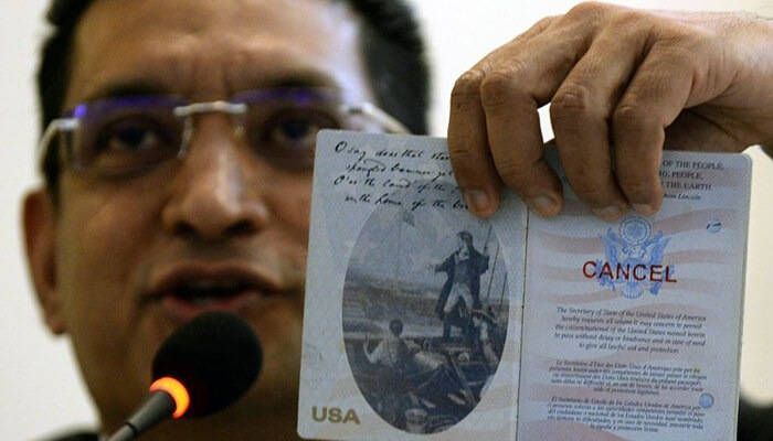 lawyer ali sabry holds a document that is