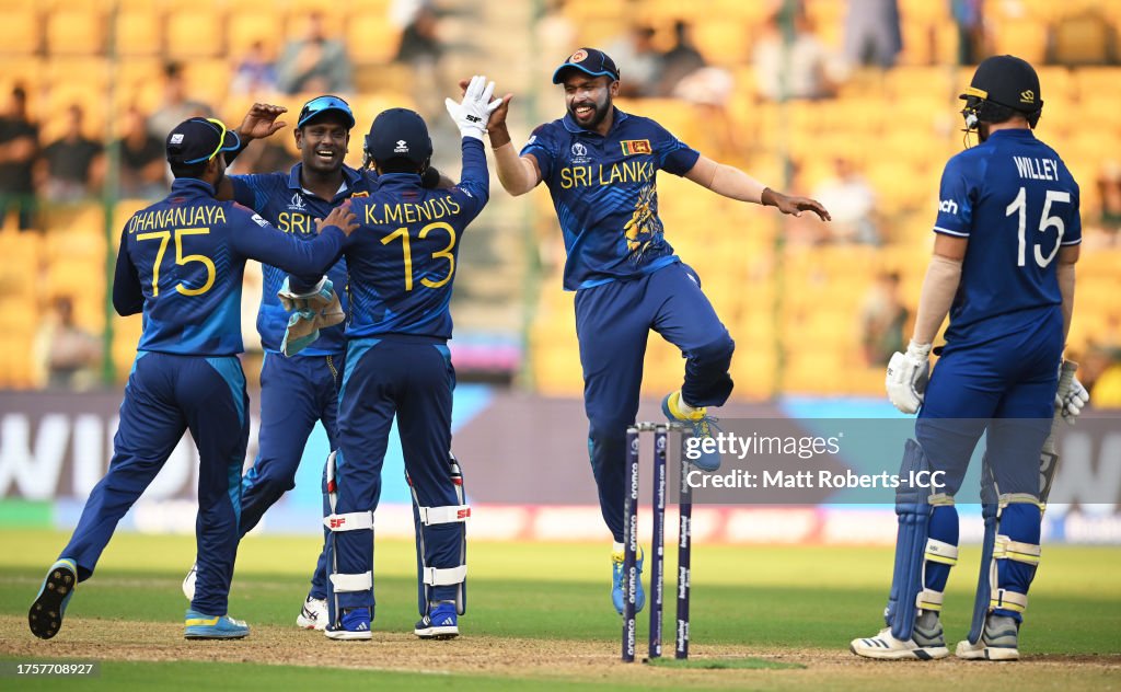 BANGALORE, INDIA - OCTOBER 26: Kusal Mendis of Sri Lanka celebrates the run out wicket of Adil Rashid of England during the ICC Men's Cricket World Cup India 2023 between England and Sri Lanka at M. Chinnaswamy Stadium on October 26, 2023 in Bangalore, India. (Photo by Matt Roberts-ICC/ICC via Getty Images)