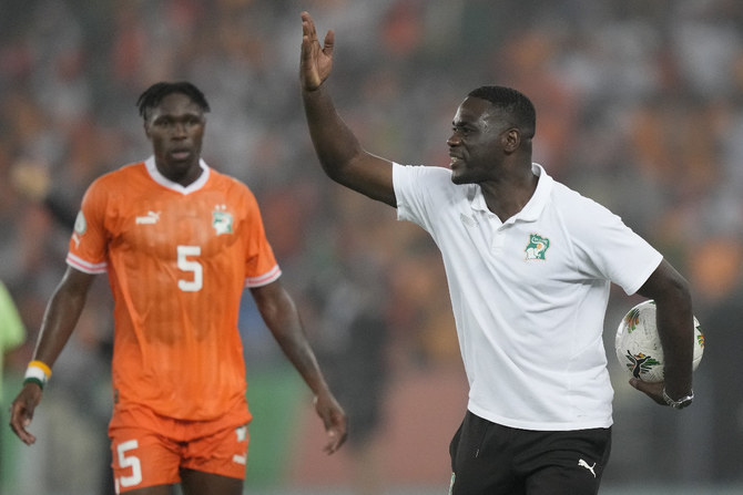 Ivory Coast's interim coach Emerse Fae gestures from the touchline during the African Cup of Nations semifinal soccer match between Ivory Coast and DR Congo, at the Olympic Stadium of Ebimpe in Abidjan, Ivory Coast, Wednesday, Feb. 7, 2024. (AP Photo/Sunday Alamba)