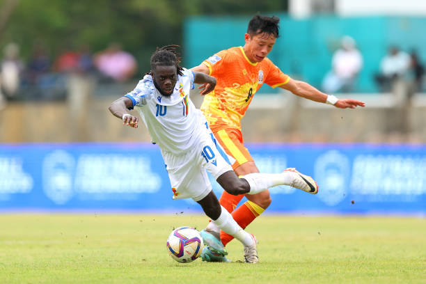 COLOMBO, SRI LANKA - MARCH 22: Karl Namnganda of Central African Republic is challenged by Karma Shedrup Tshering of Bhutan during the FIFA Series 2024 Sri Lanka match between Central African Republic and Bhutan at Race Course Ground on March 22, 2024 in Colombo, Sri Lanka. (Photo by Pakawich Damrongkiattisak - FIFA/FIFA via Getty Images)