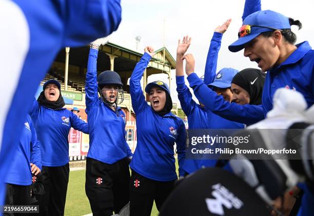 MELBOURNE, AUSTRALIA - JANUARY 30: Nahida Sapan (C) of the Afghanistan Women's team leads a cheer in a huddle before the match against a Cricket without Borders XI at Junction Oval on January 30, 2025 in Melbourne, Australia. (Photo by Philip Brown/Popperfoto/Popperfoto via Getty Images)