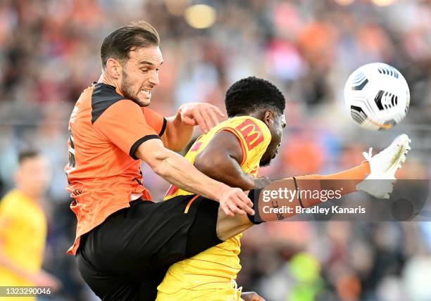 BRISBANE, AUSTRALIA - JUNE 13: Jack Hingert of the Roar kicks the ball clear from Al Hassan Toure of Adelaide during the A-League Elimination Final match between Brisbane Roar and Adelaide United at Moreton Daily Stadium, on June 13, 2021, in Brisbane, Australia. (Photo by Bradley Kanaris/Getty Images)
