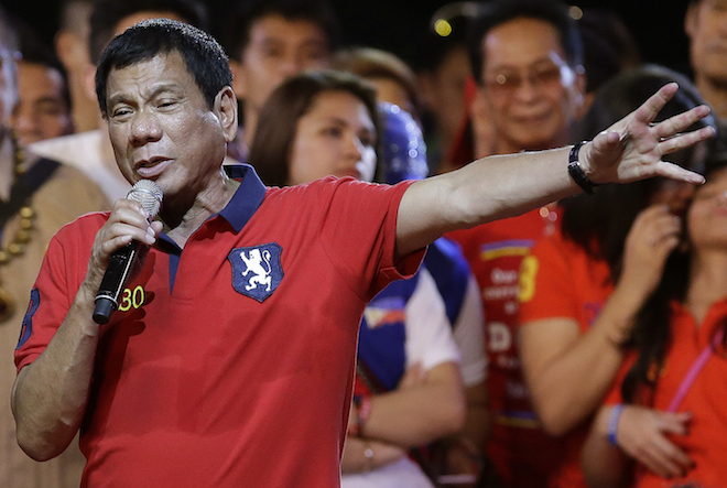 Philippine presidential race front-runner Davao city mayor Rodrigo Duterte gestures during his final campaign rally in Manila, Philippines on Saturday, May 7, 2016. A bruising presidential campaign drew to a close in the Philippines Saturday with a last-minute attempt by the president to unify candidates against a front running mayor perceived as a threat to democracy virtually collapsing. (AP Photo/Aaron Favila)