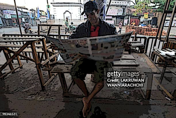 A man reads a newspapers on the streets in Colombo on April 9, 2010. Sri Lanka's ruling party is running well ahead of the fractured opposition, early results showed, in a vote marked by record low turnout and reports of violence and voter intimidation. President Mahinda Rajapakse's United People's Freedom Alliance was leading in 21 out of 28 polling divisions declared so far following Thursday's parliamentary poll, according to the elections department. AFP PHOTO/ Lakruwan WANNIARACHCHI (Photo credit should read LAKRUWAN WANNIARACHCHI/AFP via Getty Images)
