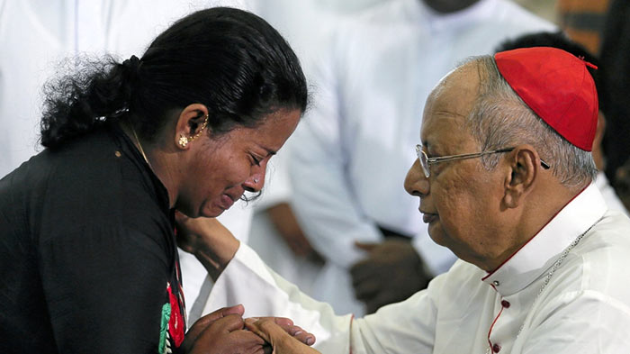relative of a victim of easter bombings in sri lanka meets cardinal malcolm ranjith