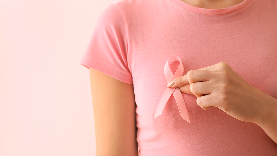 breast cancer lady holding ribbon