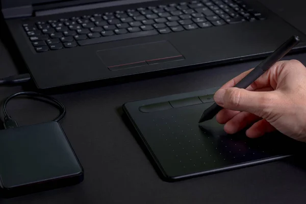 depositphotos 424417174 stock photo hand drawing pen tablet laptop
