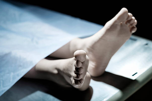 A close-up of the foot of a dead person in a morgue.