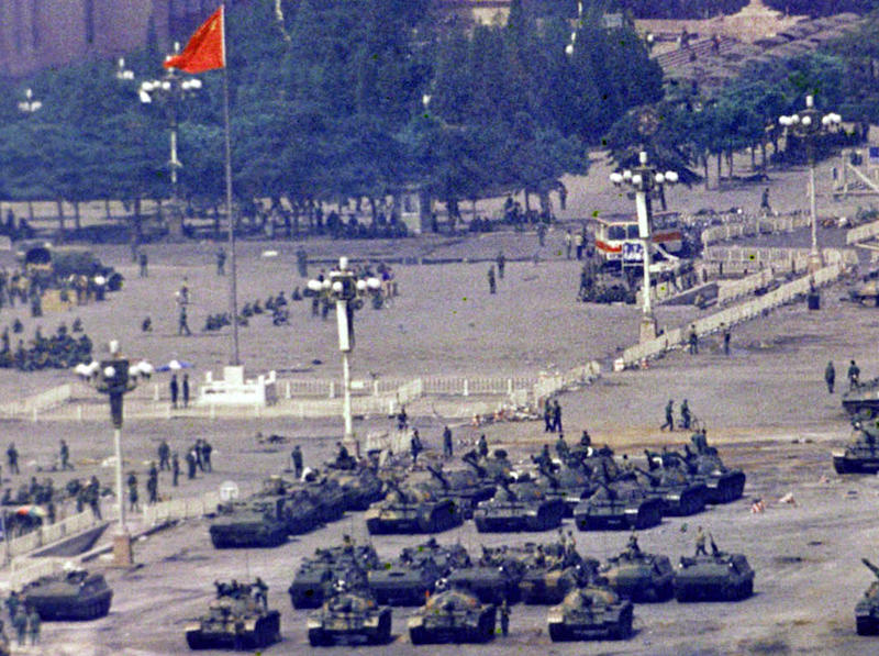 Chinese troops and tanks gather in Beijing, June 5, 1989, one day after the military crackdown that ended a seven week pro-democracy demonstration on Tiananmen Square. Hundreds were killed in the early morning hours of June 4. (AP Photo/Jeff Widener)