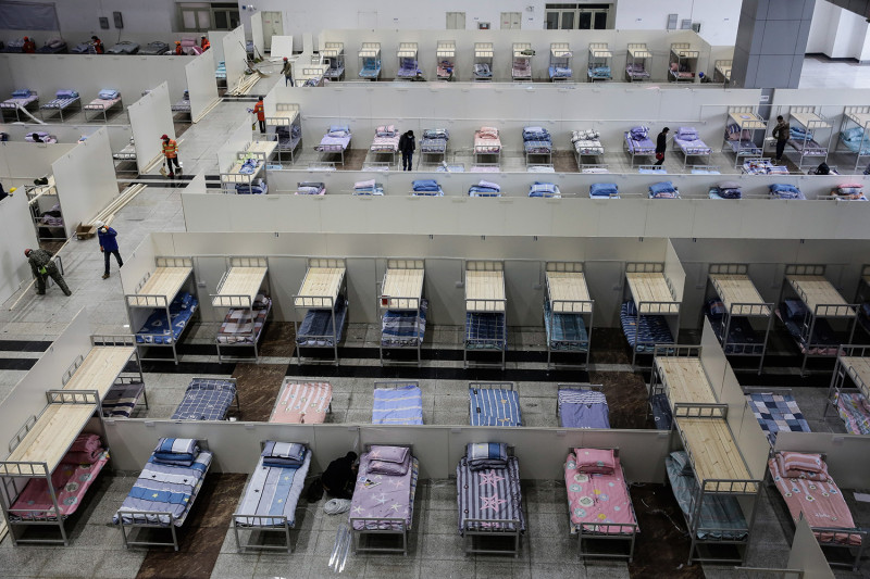Workers prepare the Wuhan International Conference and Exhibition Center to serve as a temporary hospital for novel coronavirus patients in Wuhan, China, on Feb. 4. Stringer/Anadolu Agency via Getty Images