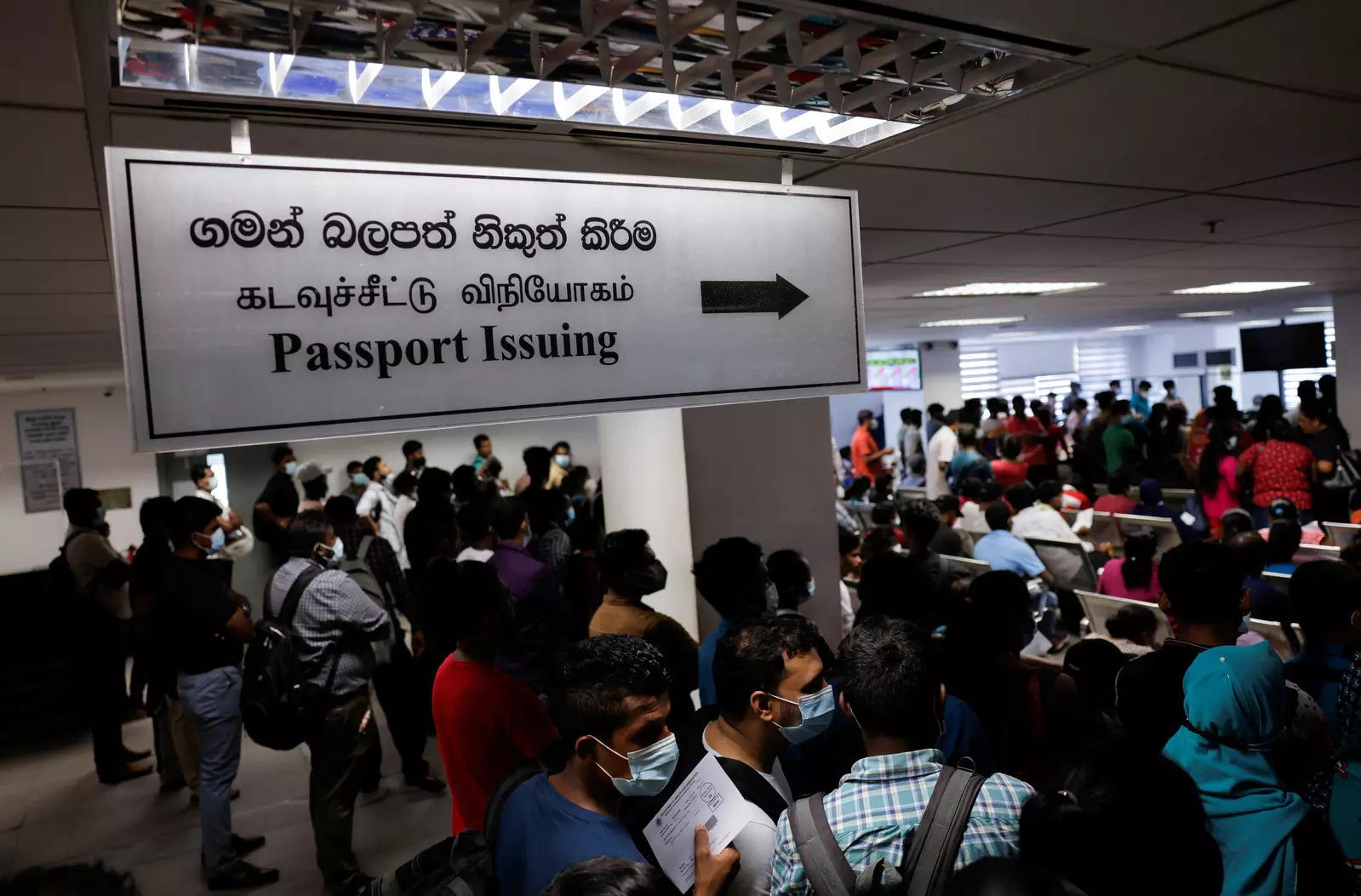 sri lankans gather outside the immigration and emigration department to get their passports to leave the country amid the countrys economic crisis